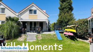 Gartenseite Ferienhaus Schakelvilla mit Ruderboot und Sauna